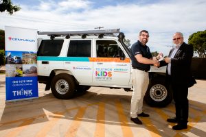 Centurion CEO Justin Cardaci hands over the keys to the new 4WD to Glenn Pearson, Head of Aboriginal Health and Wellbeing at Telethon