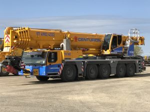 Centurion crane performing lift and shift rigging services in Queensland.