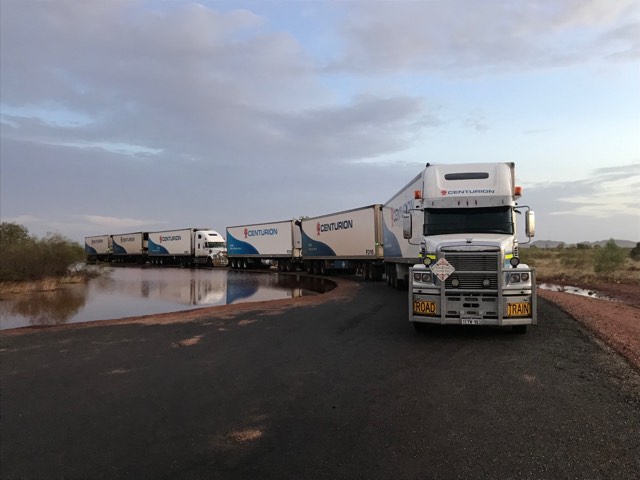 A convoy of trucks waiting for the roads to open south of Kununurra after cyclone Veronica in March 2019